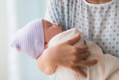 Mom holding newborn baby