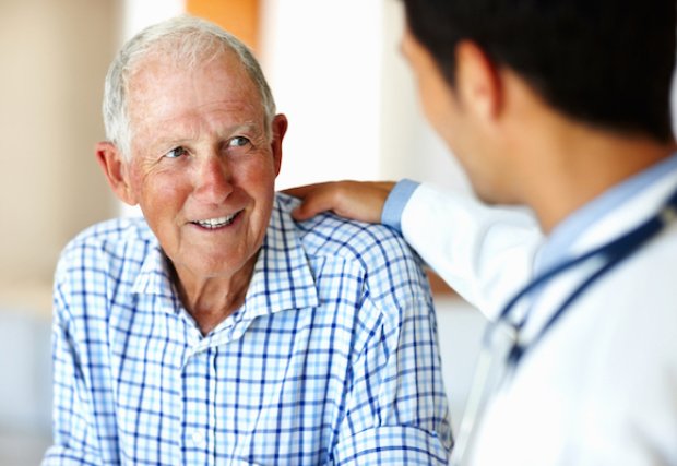 An older male patient talking to his doctor