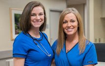 Two female nurses smiling